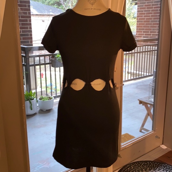 Small black shortsleeve dress with cut outs and knots at stomach waist level​ - Picture 4 of 8